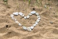 Heart shaped symbol made of small stones Royalty Free Stock Photo