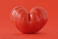 Heart shaped tomato on red background - Love Royalty Free Stock Photo