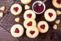 Heart shaped traditional linzer cookies with strawberry jam. Valentine s day concept. Royalty Free Stock Photo