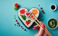 Heart shaped Valentine day sushi set. Classic sushi rolls, philadelphia, maki set for two, with two pairs of