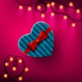 Heart shaped Valentines Day gift box with red bow and ribbon Royalty Free Stock Photo