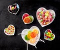 Heart shaped white bowls filled with hard candies Royalty Free Stock Photo