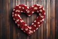 A heart-shaped wreath for valentines day decorations on a wooden house door