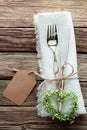 Heart Shaped Wreath and Wedding Cutlery on White Napkin Royalty Free Stock Photo