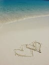 Heart shapes on white sand beach Royalty Free Stock Photo