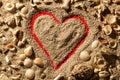 Heart and shells. Sand with red background. Royalty Free Stock Photo