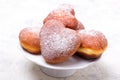 Heart sheped donuts with powdered sugar on white background