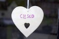 Heart with sign closed in window shop Royalty Free Stock Photo