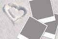 Heart in the snow and photos Royalty Free Stock Photo