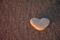 Heart of stone on the pebble beach. Love concept. Valentine background Royalty Free Stock Photo
