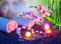 Heart of stones massage with candles, orchids Royalty Free Stock Photo