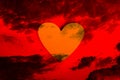 Heart symbol of love on blood red sky background