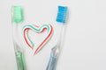 The heart symbol is made from a three-color toothpaste and is lo Royalty Free Stock Photo