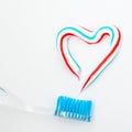 The heart symbol is made from a three-color toothpaste and is lo Royalty Free Stock Photo