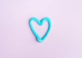 Heart shaped toothpaste line on pink Royalty Free Stock Photo