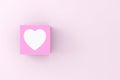 Heart symbol on a pink cube block. Love, relationship and valentine's day concept Royalty Free Stock Photo