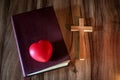 The heart symbol is placed on the Bible. And with a cross With the power and power of holiness which brings luck and power of