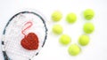 Heart of tennis balls and red heart on tennis racket on white snow winter background. Love Valentines day concept with tennis Royalty Free Stock Photo