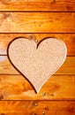 Heart in a tree trunk on cork background