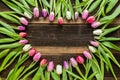 Heart from Tulips Flowers on rustic table for March 8, International Womens Day, Birthday , Valentines Day or Mothers day - Close Royalty Free Stock Photo