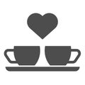 Heart and two coffee cups solid icon. Two mugs and heart vector illustration isolated on white. Romantik drink glyph