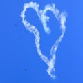 Heart skywriting with birds in sky Royalty Free Stock Photo