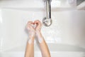 Heart washing children hands soap foam and water