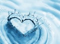 Heart from water splash with bubbles on blue water background Royalty Free Stock Photo