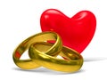 Heart and wedding rings on white background Royalty Free Stock Photo