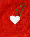 Heart white on a vibrant red soft dusty background with small green hearts coming out of it. Valentine love aesthetic design Royalty Free Stock Photo