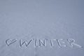 Heart and winter inscription on a fresh snow