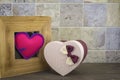 Heart in a wooden frame with a gift box