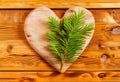 Heart on a wooden table. Valentines Day greeting card