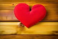 Heart on a wooden table. Valentines Day greeting card