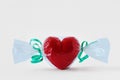 Heart wrapped like candy on white background - Concept of love