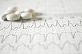 Heartbeat represented on paper. Electrocardiogram with selective focus. Representation of cardiac arrhythmias