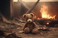 Heartbreaking Concept - sad teddy bear in ruins of house destroyed at war Royalty Free Stock Photo