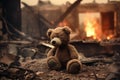 Heartbreaking Concept - sad teddy bear in ruins of house destroyed at war Royalty Free Stock Photo