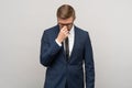 Heartbroken businessman in suit, office worker worry about bankruptcy job loss on grey background.