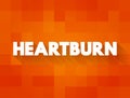 Heartburn is a burning feeling in the chest caused by stomach acid travelling up towards the throat, text concept background