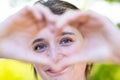 Heartfelt Connection: Beautiful Woman Embracing Love and Joy, portrait of a beautiful young woman looking through the Royalty Free Stock Photo