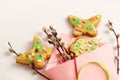 Heartfelt gifts for women\'s day: gingerbread cookies in the shape of butterflies and flowers among willow branches in yellow