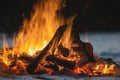 The hearth burns beautifully. Burning wood and hot flames, on a dark background, close-up. A big bonfire made of boards. Firewood Royalty Free Stock Photo