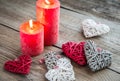 Hearts with burning candles on the wooden background Royalty Free Stock Photo