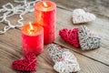 Hearts with burning candles on the wooden background Royalty Free Stock Photo