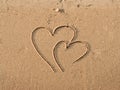 Hearts drawn on sand Royalty Free Stock Photo