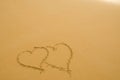 Hearts drawn on the sand of beach Royalty Free Stock Photo