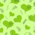 Hearts and green leaves on a light green color