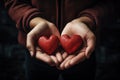 Hearts in hands symbolic gesture of affection Heart in woman hands Love giving, care, health, protection