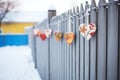 hearts hanging on a frostcovered fence